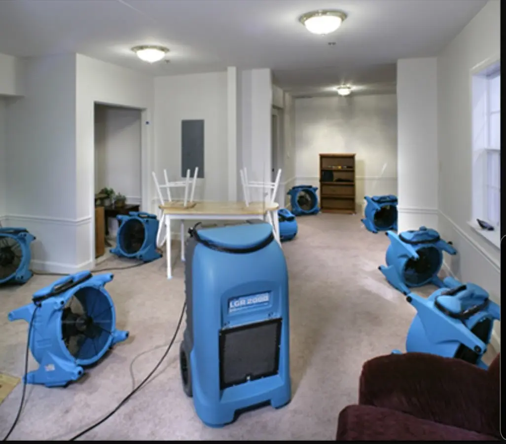 Air movers and dehumidifier setup for Water Damage Restoration in Ellicott